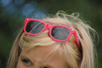 Close-up portrait of girl wearing sunglasses