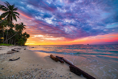 Scenic view of sea against sky at sunset