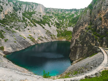 Scenic view of lake amidst rocks