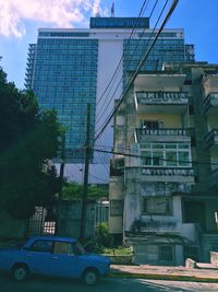 Low angle view of buildings against sky in city