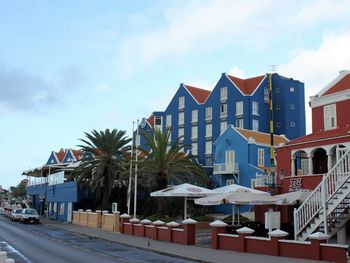 Houses against sky in city