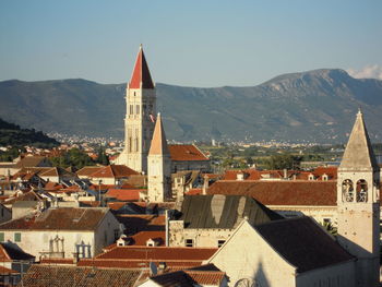 Houses in town against clear sky