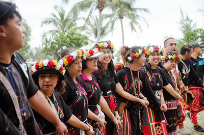 Group of people in traditional clothing standing outdoors