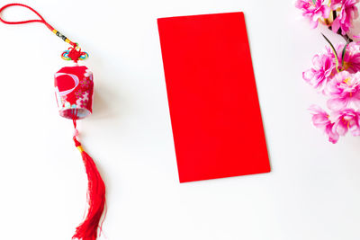 Close-up of red roses against white background