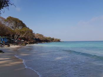 Scenic view of beach against clear sky