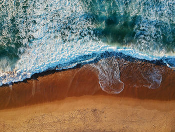 Close-up of wave on rock