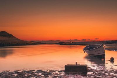 Lone boat moored in calm lake