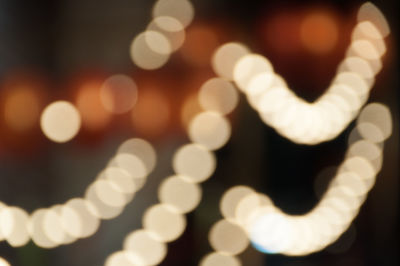 Defocused image of illuminated lights at night