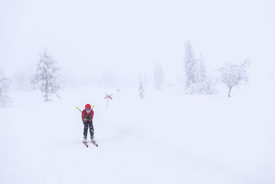 Full length of man on snow covered field