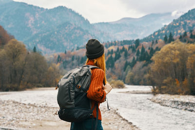 Rear view of woman looking at mountains