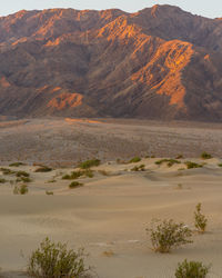 Scenic view of sea and mountains against sky