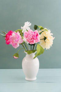 Close-up of pink flower vase on table