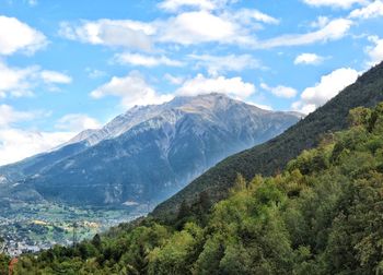 Scenic view of mountains against cloudy sky