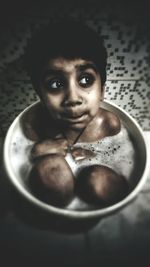 Portrait of boy in bowl