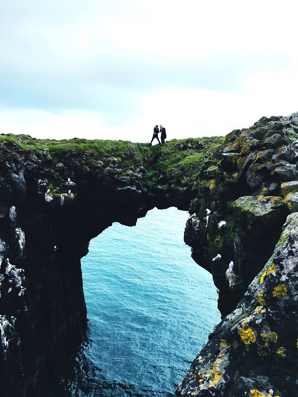 SCENIC VIEW OF SEA AND CLIFF AGAINST SKY