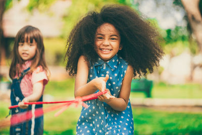 Portrait of happy girl smiling outdoors