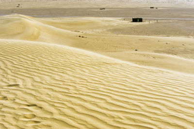 Scenic view of sand dune on beach