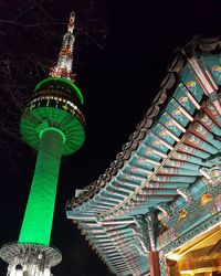 Low angle view of illuminated built structure at night