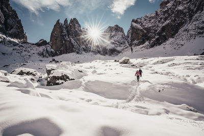 Scenic view of snow covered mountains against sky