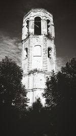 Low angle view of bell tower against sky