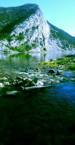 Scenic view of lake with mountains in background