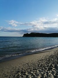 Scenic view of beach against sky