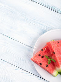 High angle view of fruits in plate on table