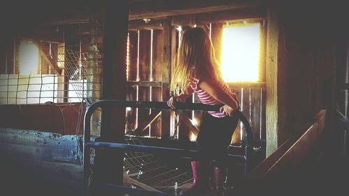 Woman looking through window