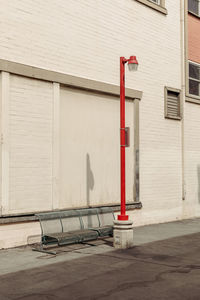 Street light on sidewalk by building