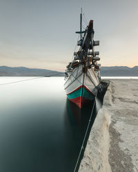 Sailboat in sea against sky