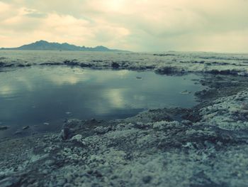 Scenic view of sea against cloudy sky