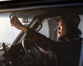 Woman sitting in car