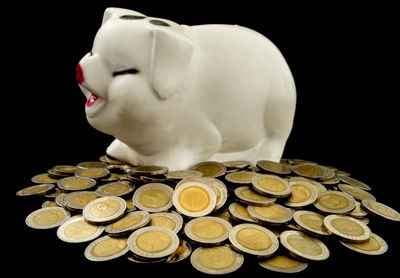 Close-up of coins on black background