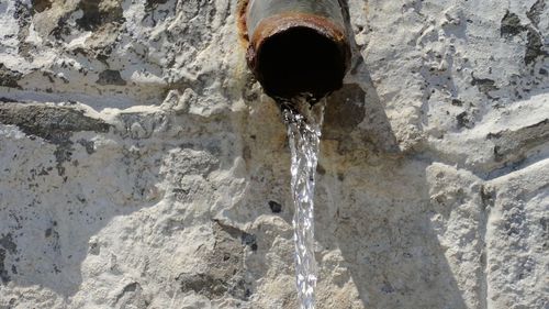 Close-up of water flowing from pipe