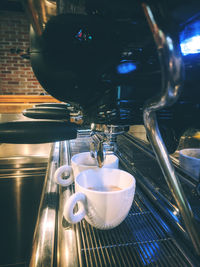 Close-up of coffee cup on table at cafe