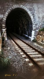 Railroad tracks in tunnel