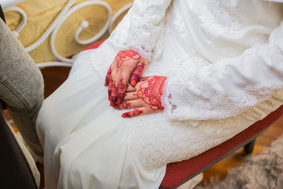High angle view of couple holding hands