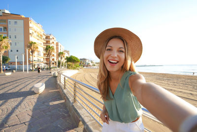 Holidays in calabria. selfie girl on crotone promenade in calabria, southern italy.