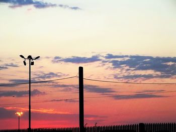 Low angle view of netting against sky during sunset