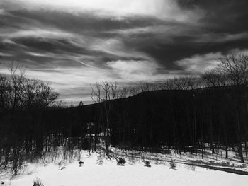 Scenic view of landscape against cloudy sky