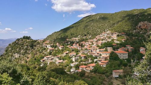 Scenic view of village on mountains