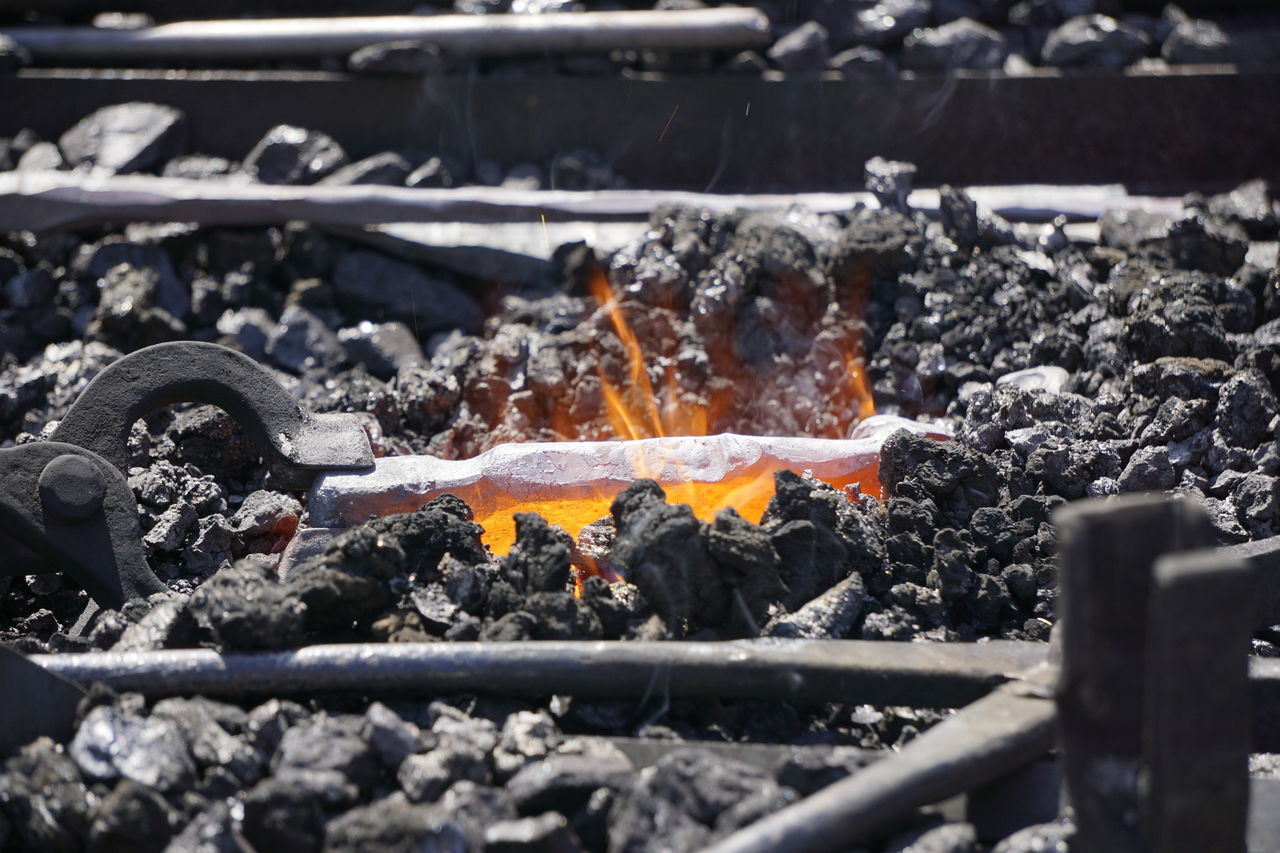 CLOSE-UP OF BURNING ON BARBECUE