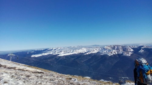 Scenic view of mountains against clear blue sky