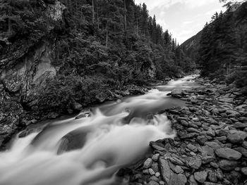 Surface level of stream flowing through rocks