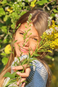 Portrait of woman with plants