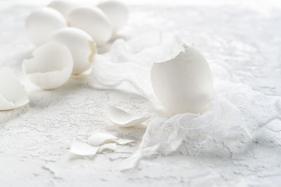 Close-up of broken egg shells on table