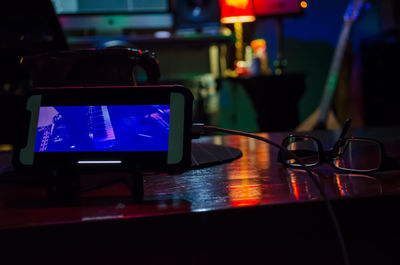 Close-up of illuminated laptop on table