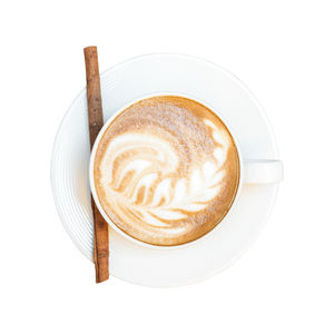 Directly above shot of cappuccino served on table against white background