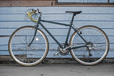 Bicycle leaning against wall