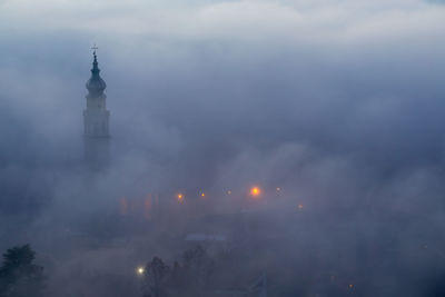 Low angle view of illuminated building against sky